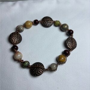 Elegant Beaded Bracelet with Bronze Accents